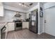 Modern kitchen with stainless steel appliances, granite countertops, and ample cabinet space at 221 Stevenson Rd, Winter Haven, FL 33884
