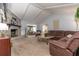 Spacious living room featuring a cozy fireplace, plush seating, and abundant natural light at 221 Stevenson Rd, Winter Haven, FL 33884