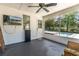 View of the pool from the screened in porch with seating at 221 Stevenson Rd, Winter Haven, FL 33884