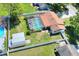 Aerial view of the property showing the pool, backyard, barn and surrounding neighborhood at 2329 Duff Rd, Lakeland, FL 33810