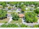 Overhead view of a single-Gathering home in a quiet neighborhood with a screened-in pool and large shed at 2329 Duff Rd, Lakeland, FL 33810