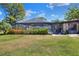 View of the patio, fenced yard, and screened pool area that makes this home great for entertaining at 2329 Duff Rd, Lakeland, FL 33810