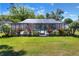 The home has a screened pool enclosure and well-maintained backyard landscaping, perfect for outdoor enjoyment at 2329 Duff Rd, Lakeland, FL 33810