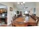 Large dining area with wooden table, flowing into an open-concept living space at 2329 Duff Rd, Lakeland, FL 33810