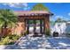 Inviting brick building with double glass doors, mature landscaping, and a well-maintained entryway at 2329 Duff Rd, Lakeland, FL 33810
