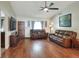 Comfortable living room with hardwood floors, leather seating, and a bright, welcoming atmosphere at 2329 Duff Rd, Lakeland, FL 33810
