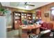 Home office with wood paneling, built-in bookshelves, and a spacious desk at 2329 Duff Rd, Lakeland, FL 33810