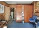 Cozy office space with wood paneling, carpet, ample storage, and comfortable seating at 2329 Duff Rd, Lakeland, FL 33810