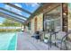 Inviting screened-in pool area with stone accents and comfortable seating for outdoor relaxation and enjoyment at 2329 Duff Rd, Lakeland, FL 33810