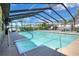 Inviting enclosed pool area with clear blue water, ample seating, and a serene outdoor space at 2329 Duff Rd, Lakeland, FL 33810