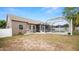 Exterior of house with a huge backyard and screened-in pool at 2569 Colonel Ford Dr, Lakeland, FL 33813