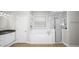 Bathroom with a soaking tub, glass-enclosed shower, and vanity with granite counters at 2569 Colonel Ford Dr, Lakeland, FL 33813