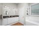 Bathroom boasts double sinks, granite counters, and a tiled floor at 2569 Colonel Ford Dr, Lakeland, FL 33813