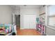 Bedroom featuring a closet, a toy shelf, and a window with blinds at 2569 Colonel Ford Dr, Lakeland, FL 33813