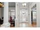 Bright foyer with tile floors and decorative glass front door, leading into the home's living spaces at 2569 Colonel Ford Dr, Lakeland, FL 33813