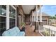 Relaxing front porch with brick flooring, classic columns, and comfortable seating at 2569 Colonel Ford Dr, Lakeland, FL 33813