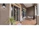 Cozy front porch with a glass front door, a swing, potted plants, and decorative accents at 2569 Colonel Ford Dr, Lakeland, FL 33813