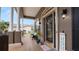 Welcoming front porch featuring brick flooring, classic columns, and a cozy seating area at 2569 Colonel Ford Dr, Lakeland, FL 33813