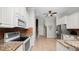 Modern kitchen with stainless steel appliances, granite countertops, and ample storage, perfect for culinary enthusiasts at 2569 Colonel Ford Dr, Lakeland, FL 33813