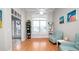 Bright living room with hardwood floors, ceiling fan, and large windows offering plenty of natural light at 2569 Colonel Ford Dr, Lakeland, FL 33813