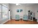 Sunlit living room featuring wood floors, coastal decor, and comfortable seating, creating a cozy atmosphere at 2569 Colonel Ford Dr, Lakeland, FL 33813