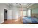 Bright main bedroom features wood floors, large windows, and a modern design at 2569 Colonel Ford Dr, Lakeland, FL 33813