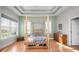 Stylish main bedroom with wood floors, large windows, and a decorative bamboo frame bed at 2569 Colonel Ford Dr, Lakeland, FL 33813