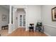 Office area with a book shelf, laminate floors and white crown molding at 2569 Colonel Ford Dr, Lakeland, FL 33813