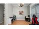 Study with a large window, chandelier, a desk with a PC, and hardwood floors at 2569 Colonel Ford Dr, Lakeland, FL 33813