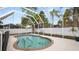 Private screened in-ground pool in a fenced backyard with tropical landscaping at 2569 Colonel Ford Dr, Lakeland, FL 33813