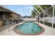 Backyard screened pool area with safety fence and easy access to covered patio at 2569 Colonel Ford Dr, Lakeland, FL 33813