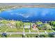 Picturesque lakefront home with lush lawn, private docks, and stunning water views at 2653 State Road 557, Lake Alfred, FL 33850