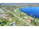 Beautiful lakefront property with a well-manicured lawn and a private dock at 2653 State Road 557, Lake Alfred, FL 33850