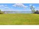 Beautiful backyard with waterfront and dock views at 2653 State Road 557, Lake Alfred, FL 33850