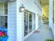 A long, covered, open air balcony offers tranquil space and beautiful lighting at 2653 State Road 557, Lake Alfred, FL 33850
