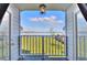 Balcony view with lawn and lake in the distance at 2653 State Road 557, Lake Alfred, FL 33850