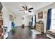 Spacious bonus room featuring hardwood flooring, storage closets, and natural light from window at 2653 State Road 557, Lake Alfred, FL 33850