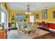 Bright dining room with colorful walls, a glass-topped table, and unique decor at 2653 State Road 557, Lake Alfred, FL 33850