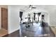 Spacious exercise room with weight equipment, ceiling fan, and a shower at 2653 State Road 557, Lake Alfred, FL 33850