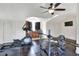 The gym features ceiling fan, wall-mounted tv, and a kitchenette at 2653 State Road 557, Lake Alfred, FL 33850