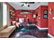 Bright home office with a large desk, comfortable seating, and ample natural light at 2653 State Road 557, Lake Alfred, FL 33850