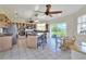 Spacious kitchen with a central island, stainless steel appliances, and sliding glass doors to the backyard at 2653 State Road 557, Lake Alfred, FL 33850