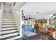 Bright living area features hardwood floors, ceiling fan and sliding glass doors to the outdoor living space at 2653 State Road 557, Lake Alfred, FL 33850