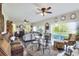 Inviting living room featuring hardwood floors, stylish decor, and access to an outdoor balcony with lake view at 2653 State Road 557, Lake Alfred, FL 33850