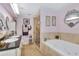 Main bathroom with a soaking tub, a glass shower, and double sinks at 2653 State Road 557, Lake Alfred, FL 33850
