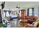 Spacious main bedroom features hardwood floors, a ceiling fan, a seating area and ample natural light at 2653 State Road 557, Lake Alfred, FL 33850