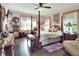 Elegant main bedroom with a four-poster bed and dark hardwood floors at 2653 State Road 557, Lake Alfred, FL 33850