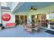 Covered patio area, ideal for outdoor entertaining, with seating and lake views at 2653 State Road 557, Lake Alfred, FL 33850
