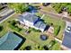 An aerial view of a home's backyard featuring a patio, trampoline, and well-maintained lawn at 2816 Fairmount Ave, Lakeland, FL 33803