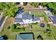 An aerial view of a home's backyard featuring a patio, trampoline, and well-maintained lawn at 2816 Fairmount Ave, Lakeland, FL 33803